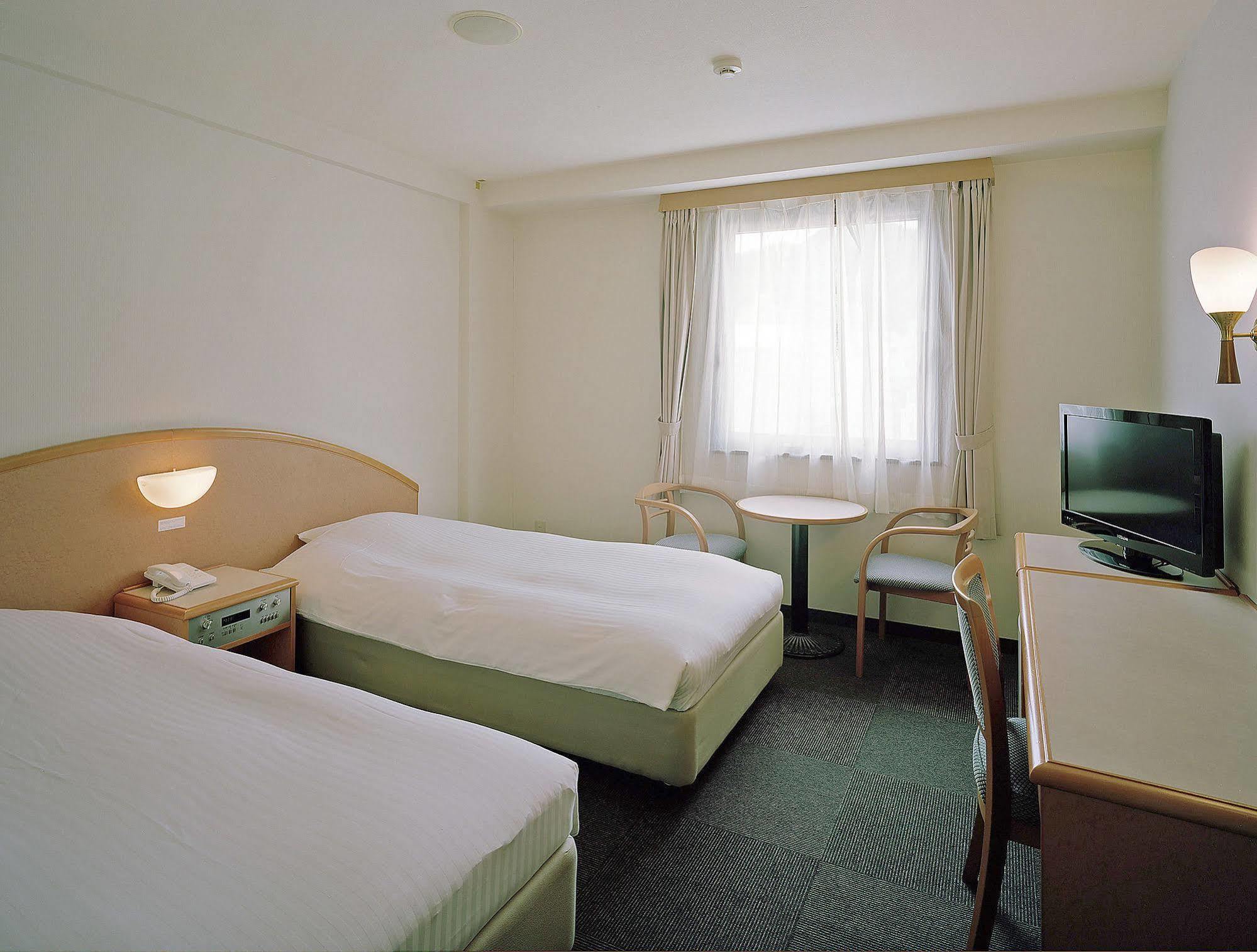 Hotel New Amami Bagian luar foto